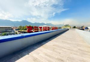 a view from the roof of a building with a sign that reads love me at Hotel Arena Suites in Bogotá