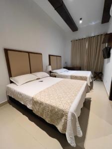 Postel nebo postele na pokoji v ubytování Hotel Dorado Plaza Centro Histórico