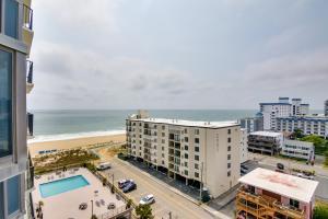 an aerial view of the beach and buildings and the ocean at Beachfront Ocean City Condo with Pool and Views! in Ocean City