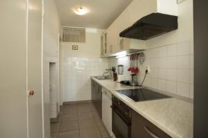 a kitchen with a sink and a counter top at Apartment Jase in Split