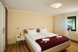 a bedroom with a large bed and a window at Laasenhof in Struppen +107 photos