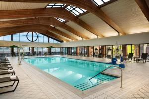 a large swimming pool in a building at Holiday Inn Washington-Dulles International Airport, an IHG Hotel in Sterling