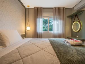Cama ou camas em um quarto em Delle Alpi 310B - Ao lado da roda-gigante
