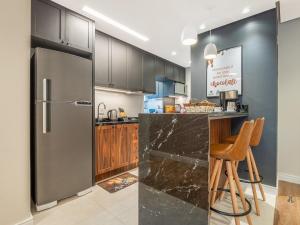A cozinha ou cozinha compacta de Delle Alpi 310B - Ao lado da roda-gigante