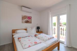 Postel nebo postele na pokoji v ubytování Apartments Basic Sveti Anton 88