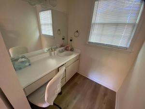 a bathroom with a sink and a mirror at Your Own Lakehouse in Macon