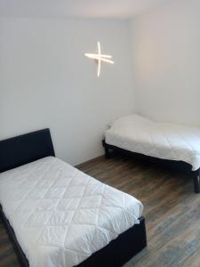 Łóżko lub łóżka w pokoju w obiekcie Maison vue magnifique