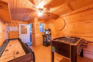 a room with a foosball table in a cabin at Cabin #1 Buffalo Herd -Pet Friendly - Sleeps 6 - Playground & Game Room in Payson