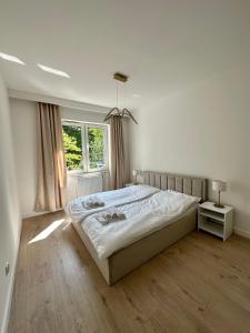 Posteľ alebo postele v izbe v ubytovaní Apartament Iława