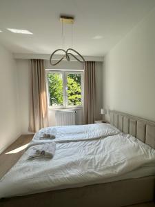 Posteľ alebo postele v izbe v ubytovaní Apartament Iława + 4 fotografie