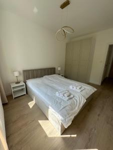 Posteľ alebo postele v izbe v ubytovaní Apartament Iława