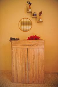 a wooden cabinet in a room with a mirror at Villa Essaouira Mogador in Ounara