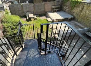 an overhead view of a patio with an iron fence at Cozy Penthouse suite happily sleeps up to five in Halifax