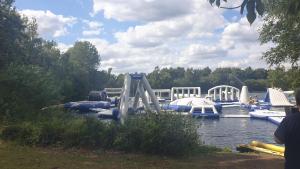 a group of boats in a river with a slide at CALDERA LUXURY LODGE in Tattershall