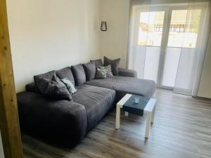 a living room with a couch and a coffee table at Apartment Lindenstein in Fritzlar