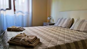 En eller flere senge i et værelse på Appartamento Girasoli in Franciacorta