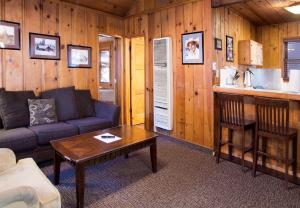 a living room with a couch and a table at Holiday Haus in Mammoth Lakes