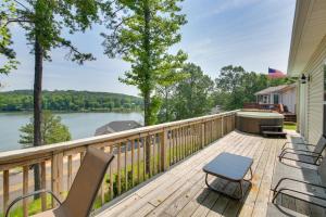 a deck with chairs and a bath tub on a house at Hot Springs Vacation Rental with Pool Access and Deck! in Hot Springs