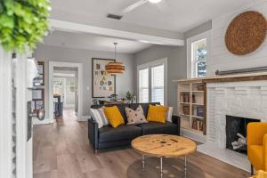 a living room with a couch and a fireplace at BeeKeeper's Inn in Tampa +33 photos