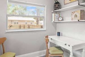 a white desk in a room with a window at BeeKeeper's Inn in Tampa