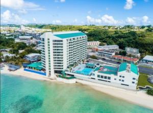 an aerial view of a hotel on the beach at Alupang Beach Tower, UPGRADED units in Tamuning