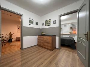 a bedroom with a bed and a sliding door at Хостел Житомир GREEN HOUSE in Zhytomyr
