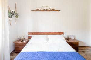 Postel nebo postele na pokoji v ubytování Maremmano BnB