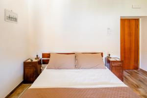 Postel nebo postele na pokoji v ubytování Maremmano BnB