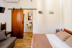 Postel nebo postele na pokoji v ubytování Maremmano BnB