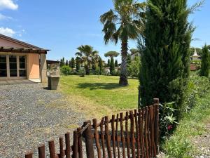 A garden outside Fattoria Palazzeta - Pet & Family Friendly