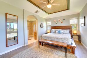 a bedroom with a bed and a ceiling fan at Luxe Maunalani Resort Condo with Pool and Beach Access in Waikoloa