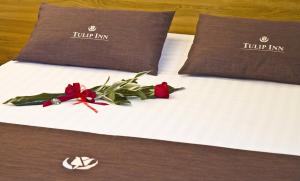 Postel nebo postele na pokoji v ubytování Tulip Inn Padova