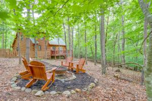 a group of chairs sitting in front of a log cabin at 'Sleeping Bear Cabin' Coosawattee! Dog Friendly! in Ellijay