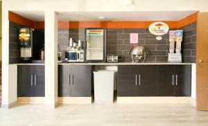 a kitchen with a counter with a coffee maker at Super 8 by Wyndham Red Wing in Red Wing
