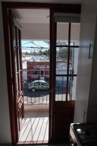 an open door with a view of a fire truck at Pueyrredon 440 in Santa Rosa