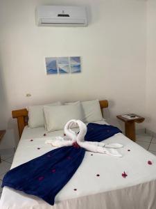 Cama ou camas em um quarto em Pousada Pedra Furada