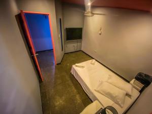 TV a/nebo společenská místnost v ubytování Fardo Hotel Boutique en Ibague - Zona G - Recepción Digital 24H