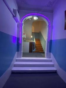 a purple hallway with stairs in a room at Lisbon Bangla in Lisbon