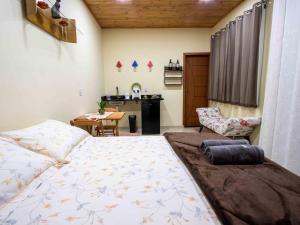 Łóżko lub łóżka w pokoju w obiekcie Pousada & Glamping Terra de Aquários