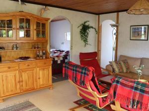 a living room with two chairs and a couch at 7 person holiday home in TRÄLÖVSLÄGE-By Traum in TrÃ¤slÃ¶vslÃ¤ge