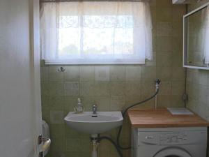 a small bathroom with a sink and a window at 7 person holiday home in TRÄLÖVSLÄGE-By Traum in TrÃ¤slÃ¶vslÃ¤ge +17 photos