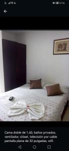 Letto o letti in una camera di Hotel Luis Ángel