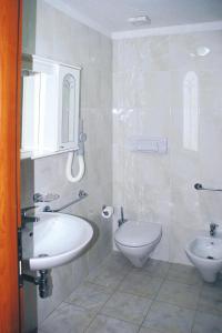a bathroom with a sink and a toilet at Apartment in Palau near Surfing Paradise in Porto Pollo