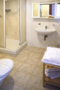 a bathroom with a shower toilet and a sink at Apartment in Palau near Surfing Paradise in Porto Pollo +29 photos