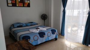 Postel nebo postele na pokoji v ubytování Hotel Luis Ángel