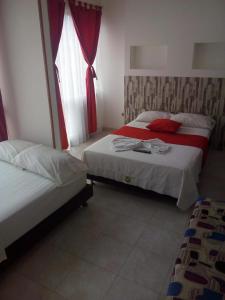 Letto o letti in una camera di Hotel Luis Ángel