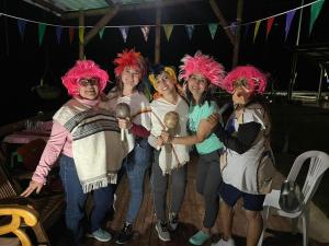 a group of people dressed in costumes posing for a picture at EcoGranjasYa in El Peñol