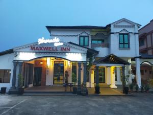 a building with a sign that reads maywell inn at Maxwell inn in Taiping