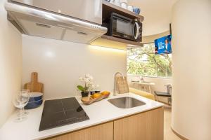Kuchyň nebo kuchyňský kout v ubytování Coliwoo Orchard - CoLiving
