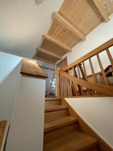a staircase in a house with wooden ceilings at In der Wassermühle in Melle